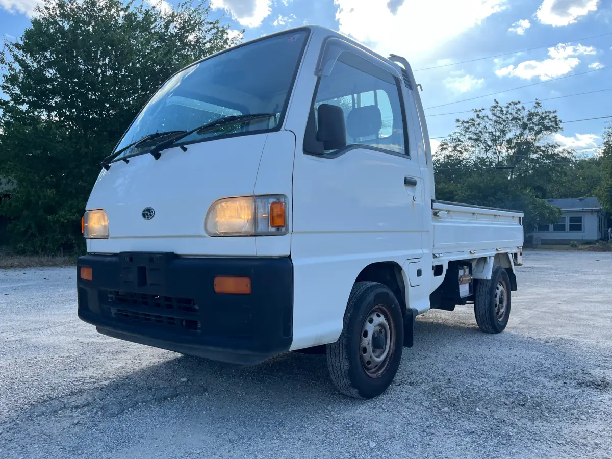 1998 Subaru Sambar 4x4 Kei Truck, front three-quarter view, sold at Sunshine Imports in Austin, TX
