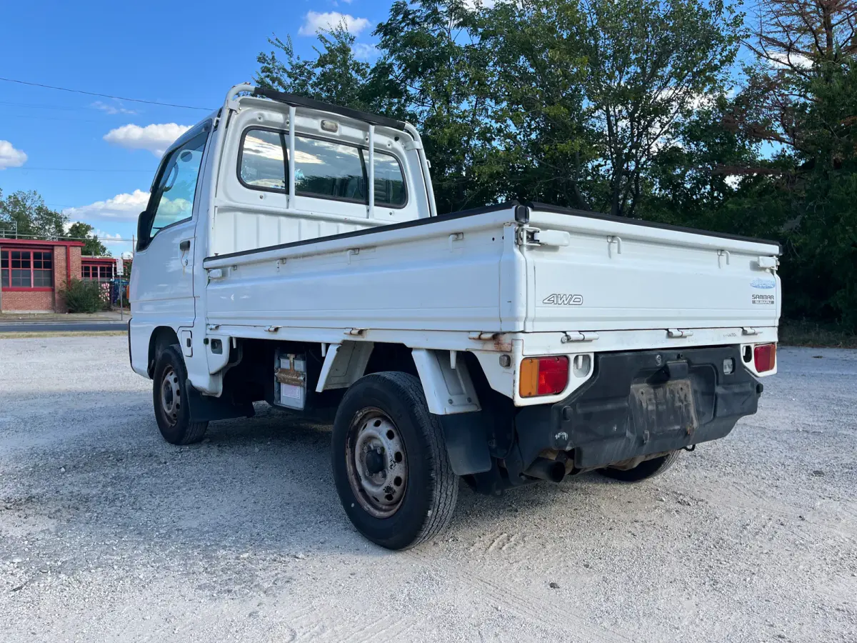 1998 Subaru Sambar 4x4 Kei Truck, rear three-quarter view, sold at Sunshine Imports in Austin, TX