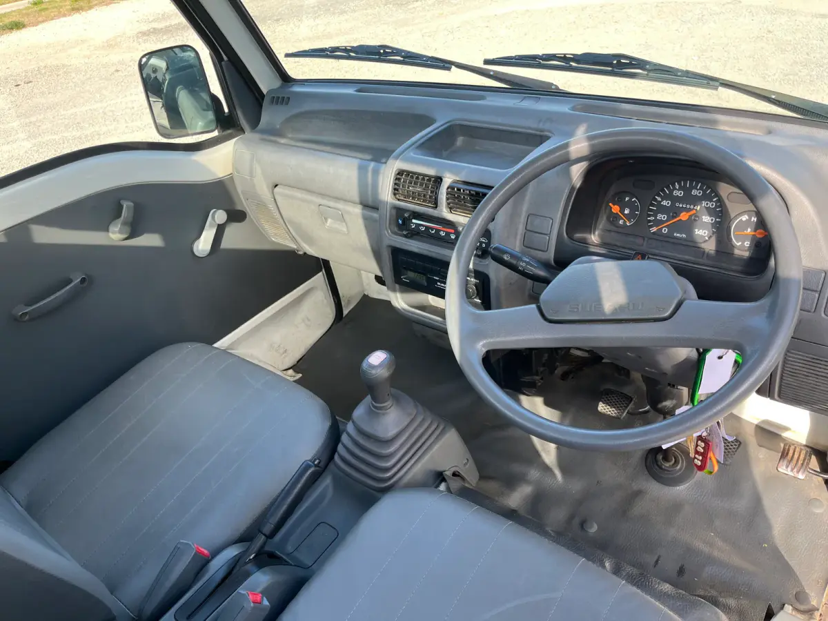 1998 Subaru Sambar 4x4 Kei Truck, dashboard and steering wheel, sold at Sunshine Imports in Austin, TX