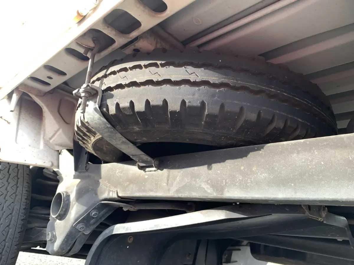 1998 Subaru Sambar 4x4 Kei Truck, spare tire under frame, sold at Sunshine Imports in Austin, TX