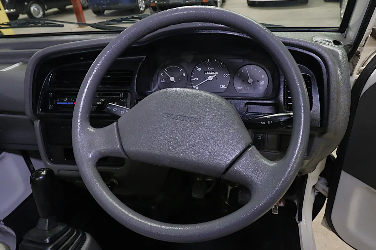 White 1998 Suzuki Carry 4x4 Kei Truck, steering wheel and dashboard, for sale at Duncan Imports in Christiansburg, VA