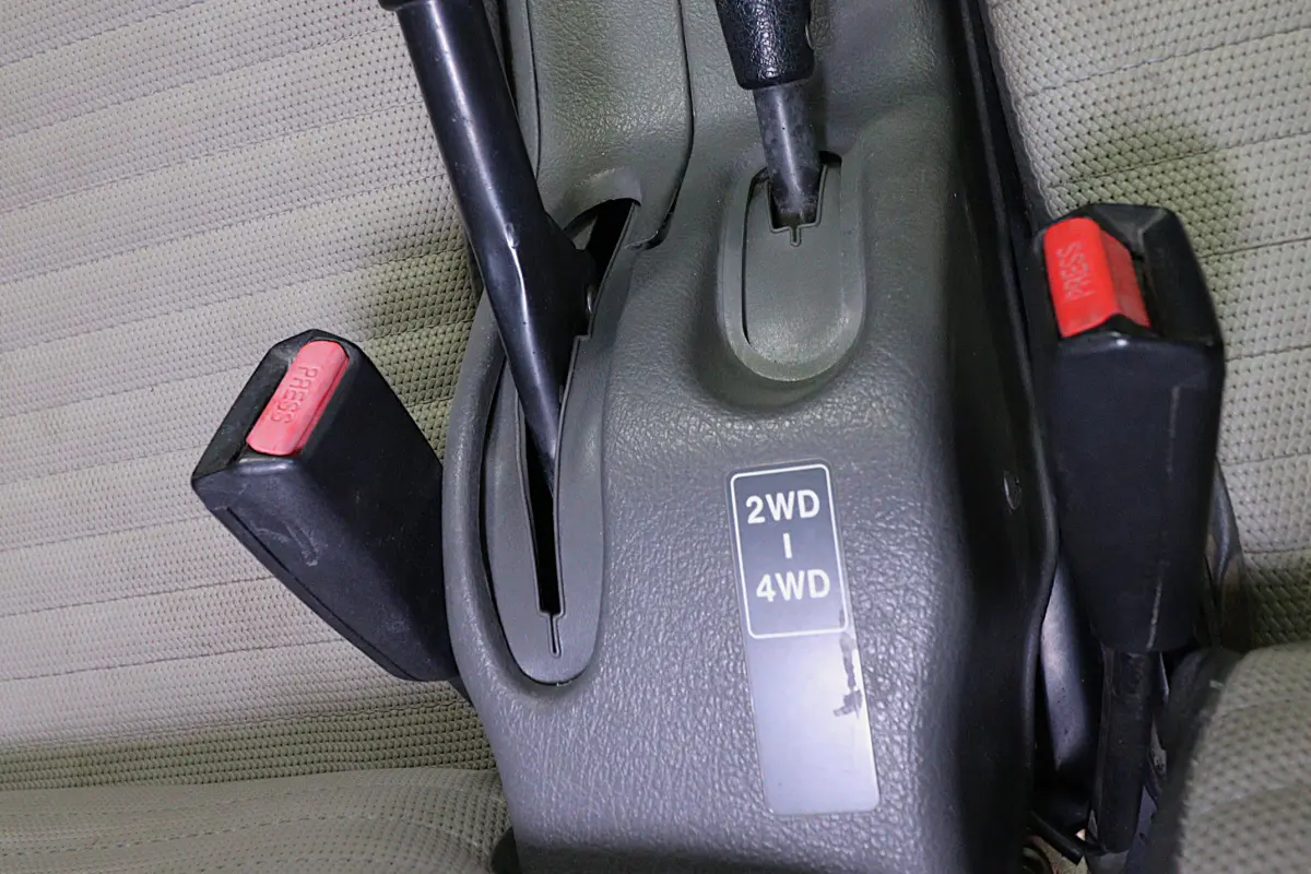White 1998 Suzuki Carry 4x4 Kei Truck, 4WD selector lever, for sale at Duncan Imports in Christiansburg, VA