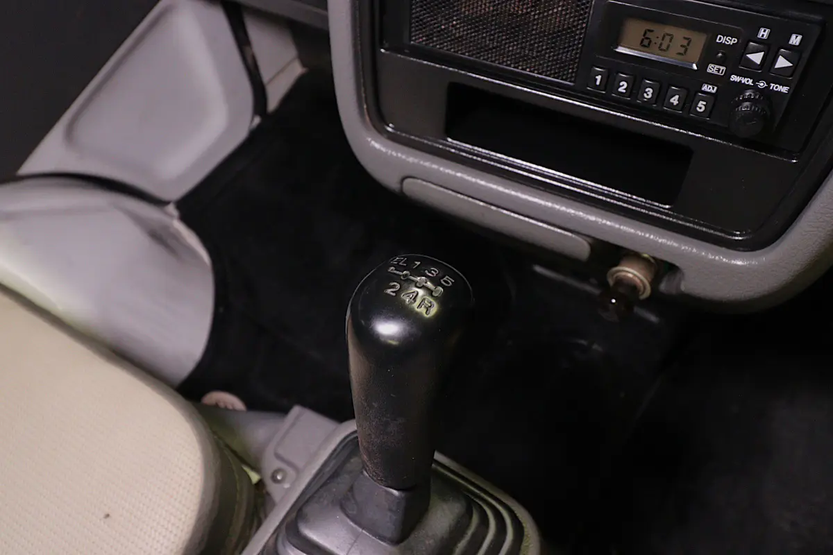 White 1998 Suzuki Carry 4x4 Kei Truck, gear shifter, for sale at Duncan Imports in Christiansburg, VA