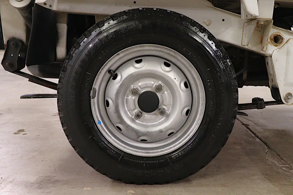 White 1998 Suzuki Carry 4x4 Kei Truck, wheel and tire, for sale at Duncan Imports in Christiansburg, VA