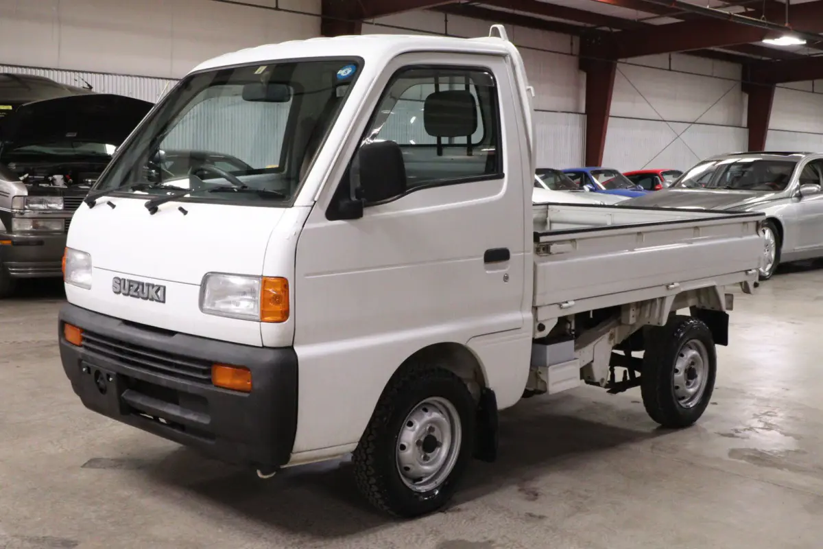 White 1998 Suzuki Carry 4x4 Kei Truck, front three-quarter view, for sale at Duncan Imports in Christiansburg, VA