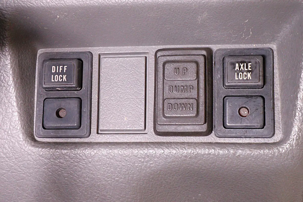 White 1998 Suzuki Carry 4x4 Kei Truck, dump and axle lock buttons, for sale at Duncan Imports in Christiansburg, VA