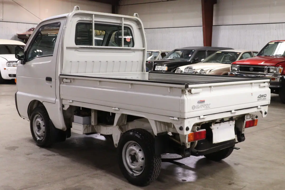 White 1998 Suzuki Carry 4x4 Kei Truck, rear three-quarter view, for sale at Duncan Imports in Christiansburg, VA