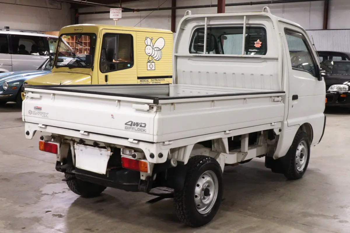 White 1998 Suzuki Carry 4x4 Kei Truck, rear three-quarter view, for sale at Duncan Imports in Christiansburg, VA