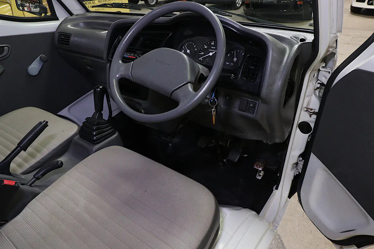White 1998 Suzuki Carry 4x4 Kei Truck, cab interior, for sale at Duncan Imports in Christiansburg, VA