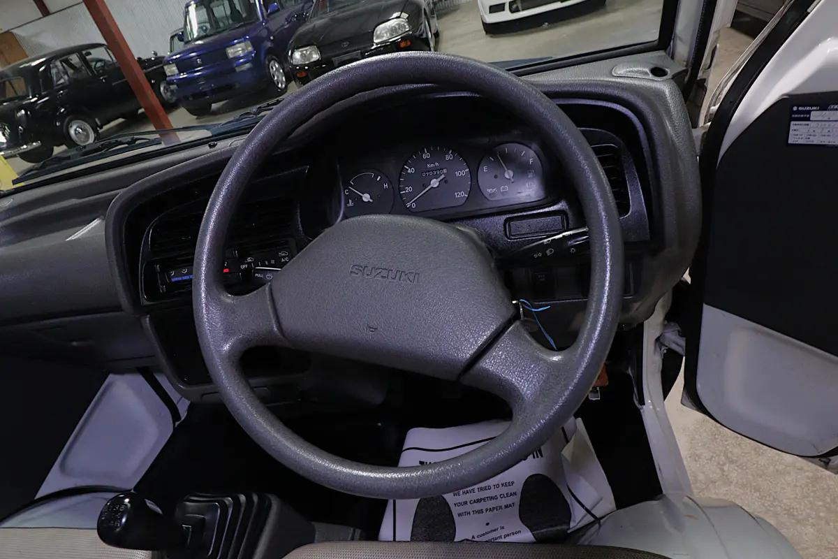 White 1998 Suzuki Carry 4x4 Kei Truck, steering wheel and dashboard, for sale at Duncan Imports in Christiansburg, VA