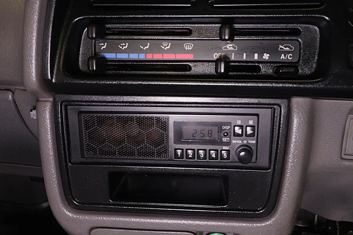 White 1998 Suzuki Carry 4x4 Kei Truck, radio and climate controls, for sale at Duncan Imports in Christiansburg, VA