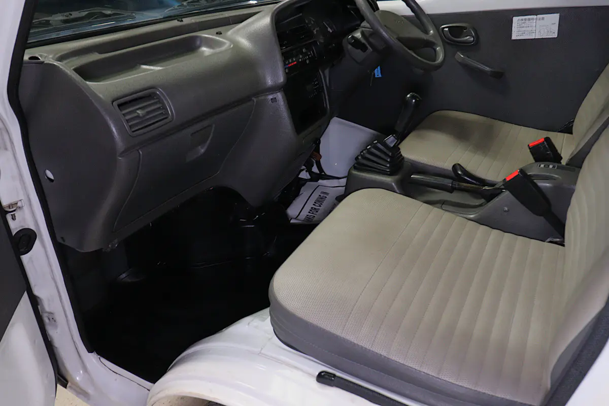 White 1998 Suzuki Carry 4x4 Kei Truck, cab interior, for sale at Duncan Imports in Christiansburg, VA