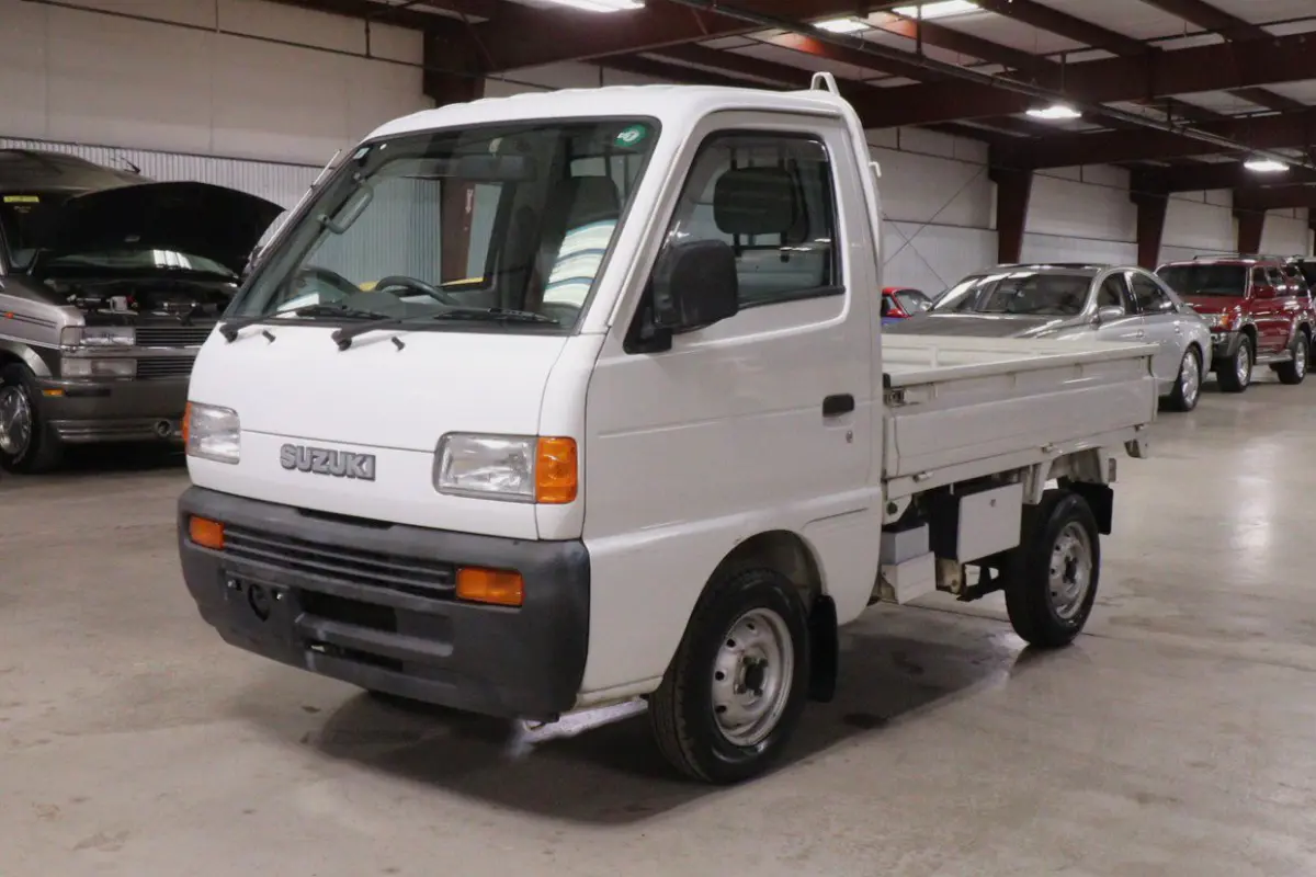 White 1998 Suzuki Carry 4x4 Kei Truck, front three-quarter view, for sale at Duncan Imports in Christiansburg, VA