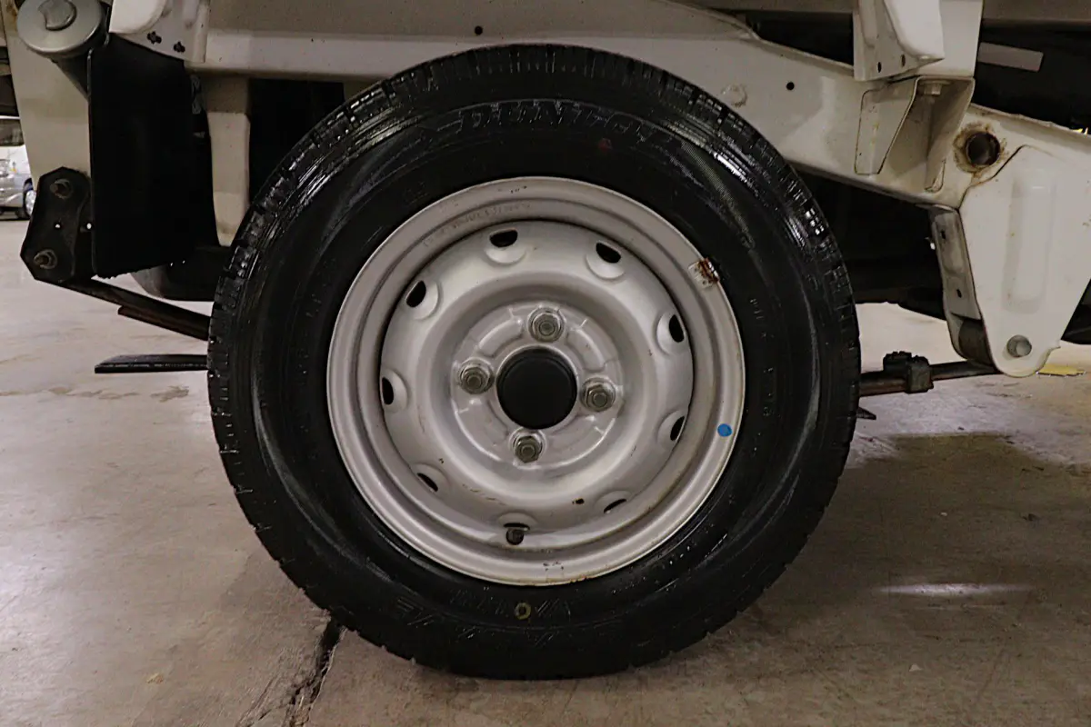 White 1998 Suzuki Carry 4x4 Kei Truck, wheel and tire, for sale at Duncan Imports in Christiansburg, VA