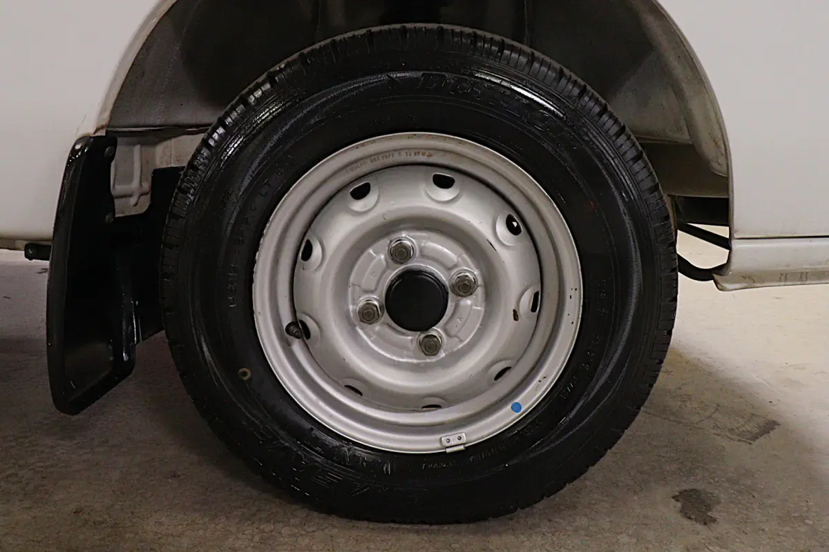 White 1998 Suzuki Carry 4x4 Kei Truck, wheel and tire, for sale at Duncan Imports in Christiansburg, VA