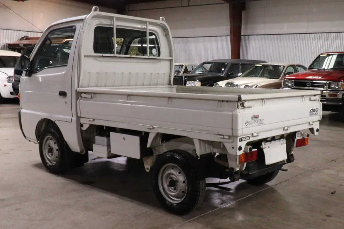 White 1998 Suzuki Carry 4x4 Kei Truck, rear three-quarter view, for sale at Duncan Imports in Christiansburg, VA