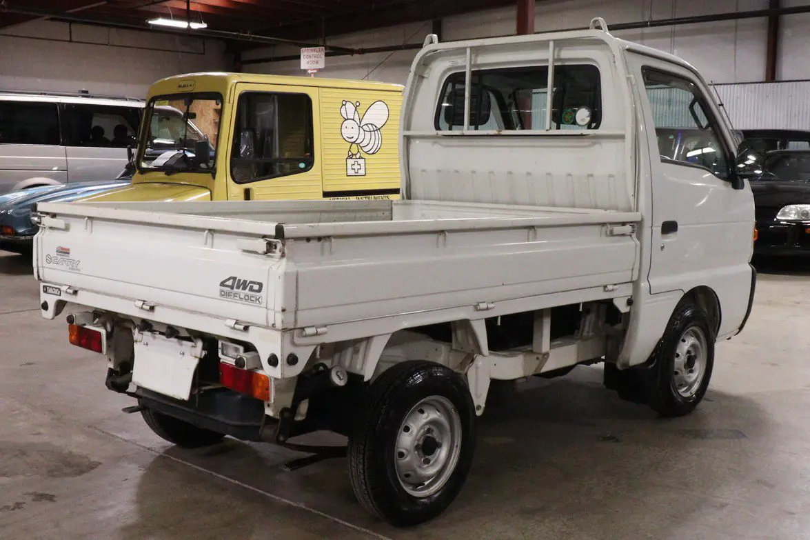 White 1998 Suzuki Carry 4x4 Kei Truck, rear three-quarter view, for sale at Duncan Imports in Christiansburg, VA