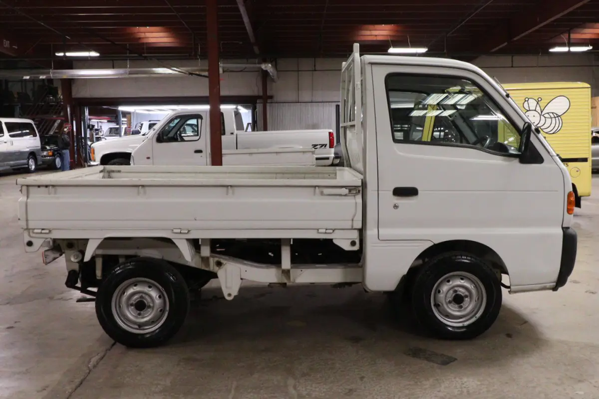 White 1998 Suzuki Carry 4x4 Kei Truck, side view, for sale at Duncan Imports in Christiansburg, VA
