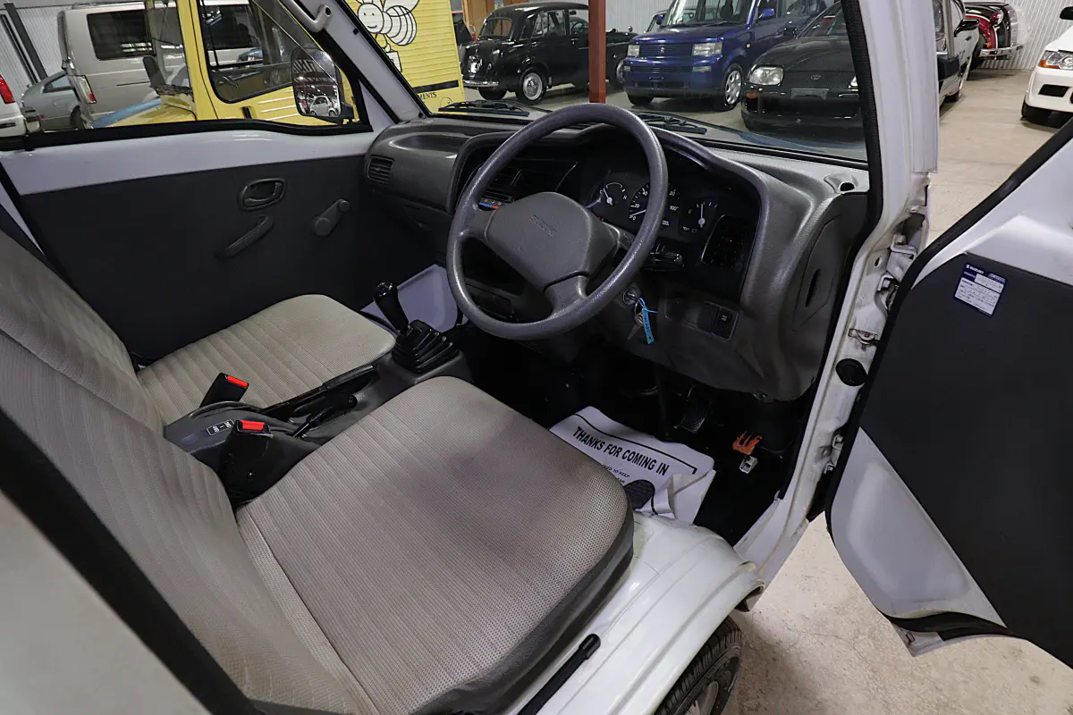 White 1998 Suzuki Carry 4x4 Kei Truck, cab interior, for sale at Duncan Imports in Christiansburg, VA