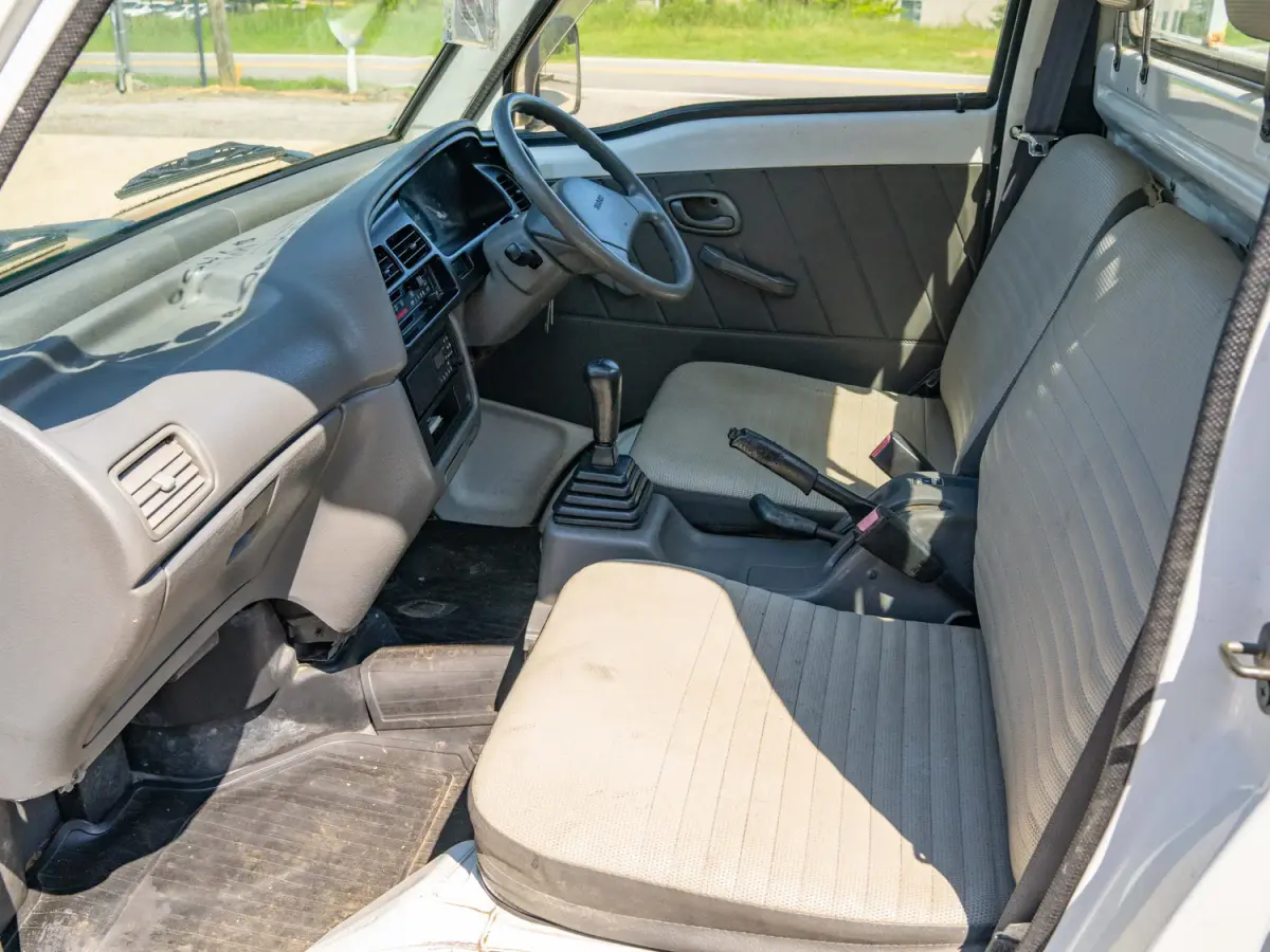 1998 Suzuki Carry, a white Kei Truck, for sale at Japan Direct Motors in Irmo, SC (photo 12 of 12)