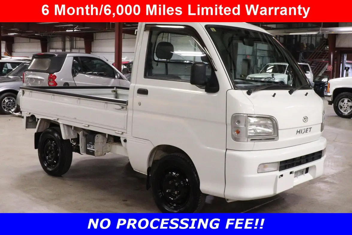 White 1999 Daihatsu Hijet 4x4 Kei Truck, front three-quarter view, for sale at Duncan Imports in Christiansburg, VA