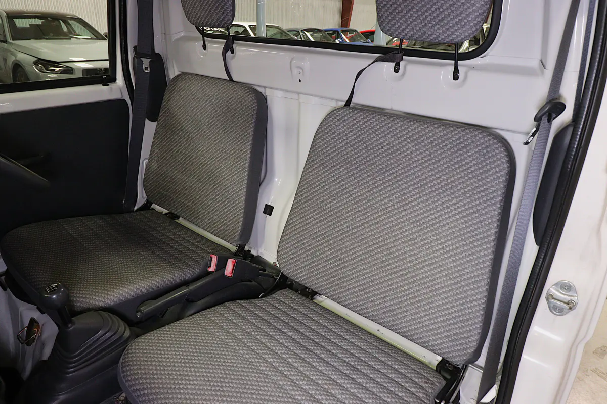 White 1999 Daihatsu Hijet 4x4 Kei Truck, seats and cab interior, for sale at Duncan Imports in Christiansburg, VA