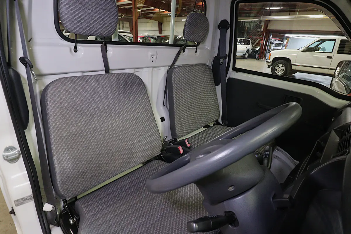 White 1999 Daihatsu Hijet 4x4 Kei Truck, cab interior with seats, for sale at Duncan Imports in Christiansburg, VA