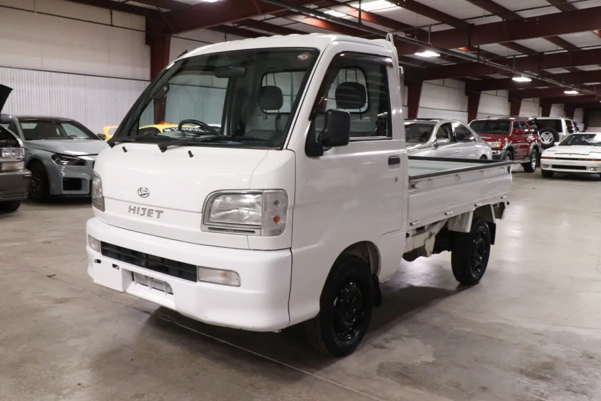 White 1999 Daihatsu Hijet 4x4 Kei Truck, front three-quarter view, for sale at Duncan Imports in Christiansburg, VA