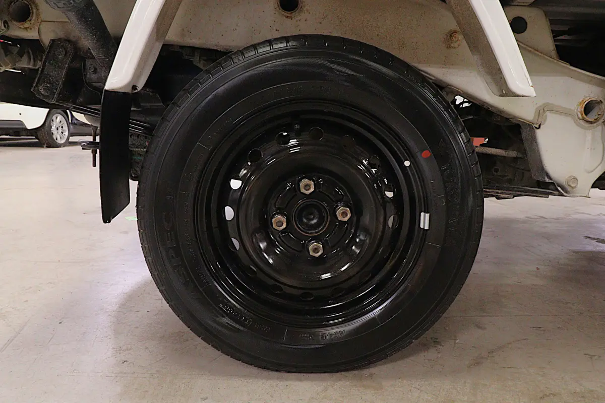 White 1999 Daihatsu Hijet 4x4 Kei Truck, wheel and tire, for sale at Duncan Imports in Christiansburg, VA