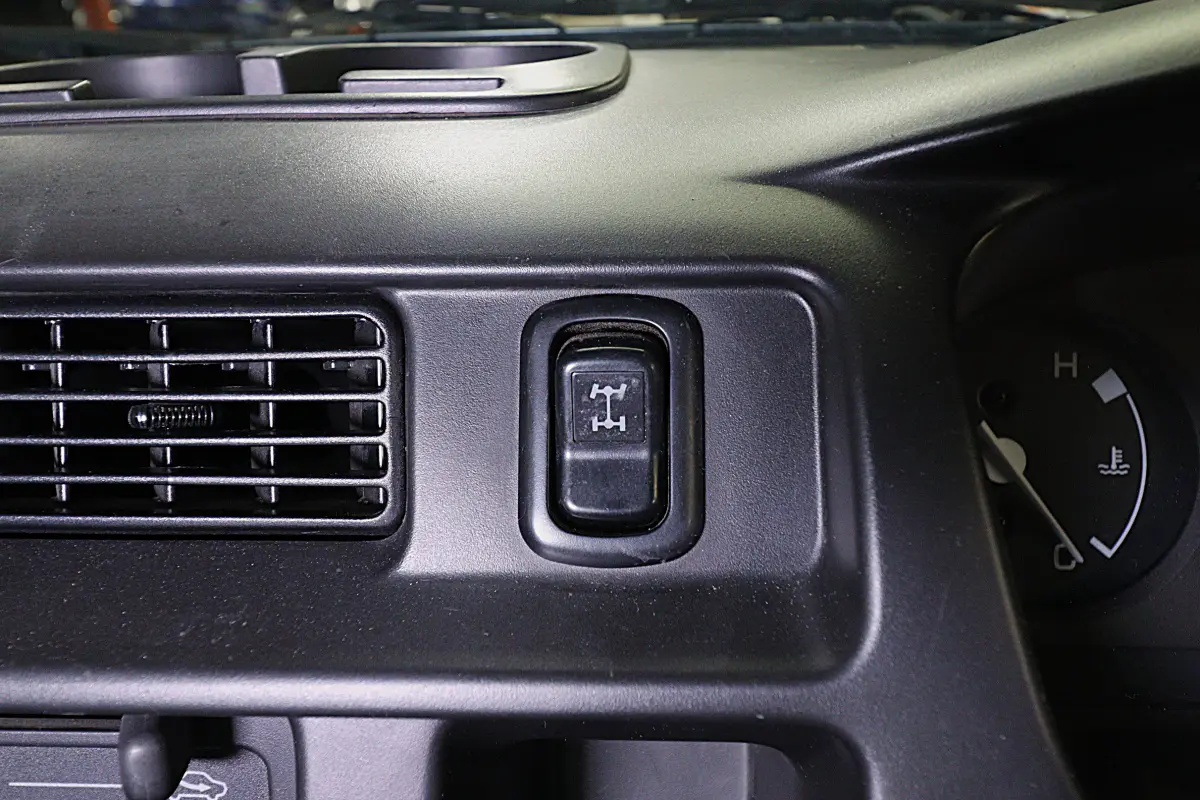 White 1999 Daihatsu Hijet 4x4 Kei Truck, dashboard 4WD switch, for sale at Duncan Imports in Christiansburg, VA