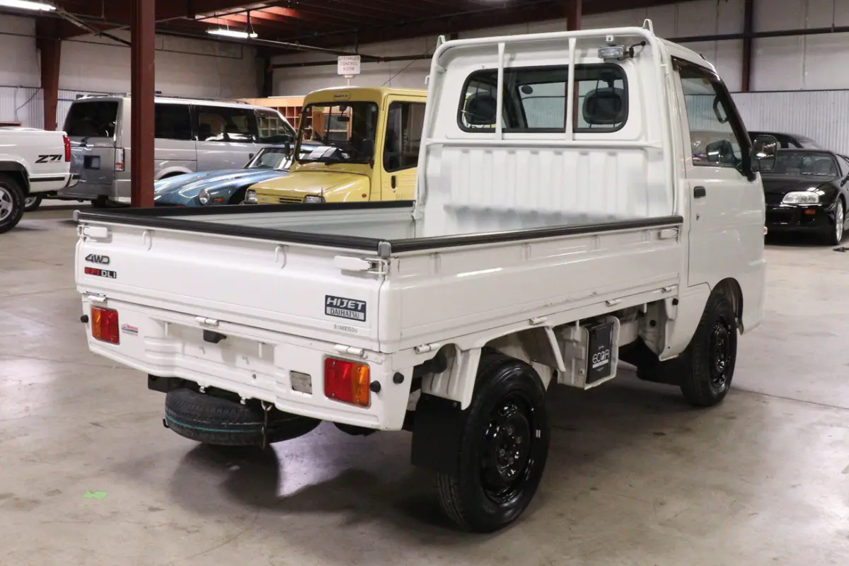 White 1999 Daihatsu Hijet 4x4 Kei Truck, rear three-quarter view, for sale at Duncan Imports in Christiansburg, VA