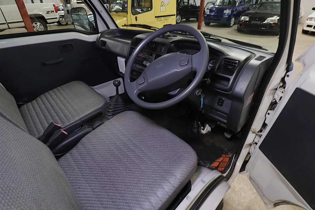 White 1999 Daihatsu Hijet 4x4 Kei Truck, cab interior, for sale at Duncan Imports in Christiansburg, VA