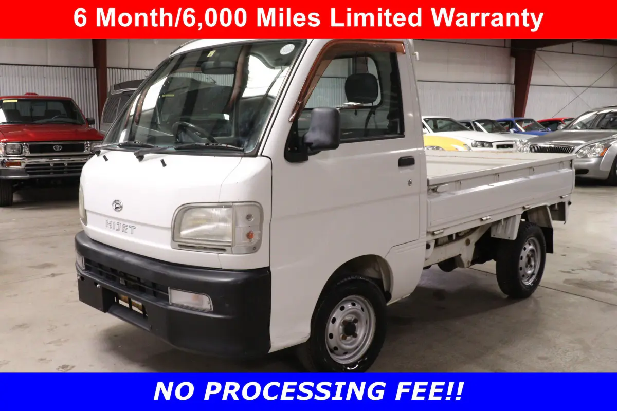 White 1999 Daihatsu Hijet 4x4 Kei Truck, front three-quarter view, for sale at Duncan Imports in Christiansburg, VA
