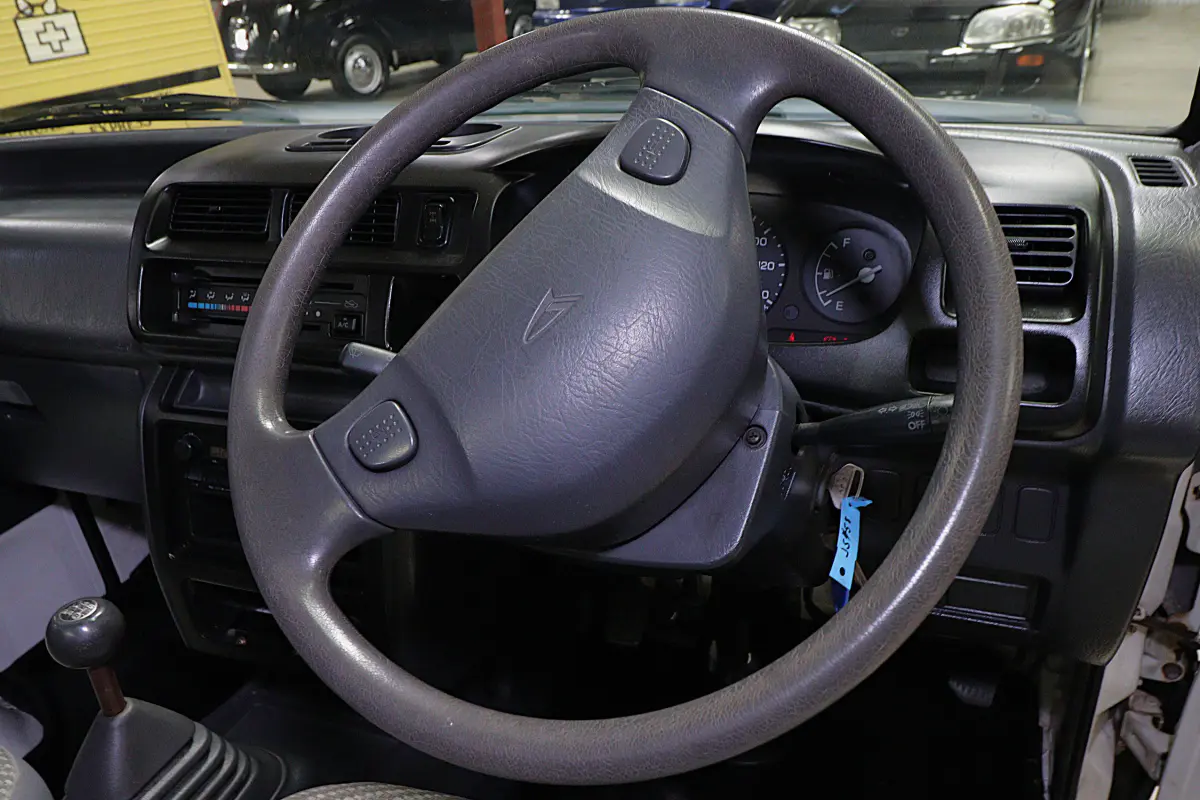 White 1999 Daihatsu Hijet 4x4 Kei Truck, steering wheel and dashboard, for sale at Duncan Imports in Christiansburg, VA