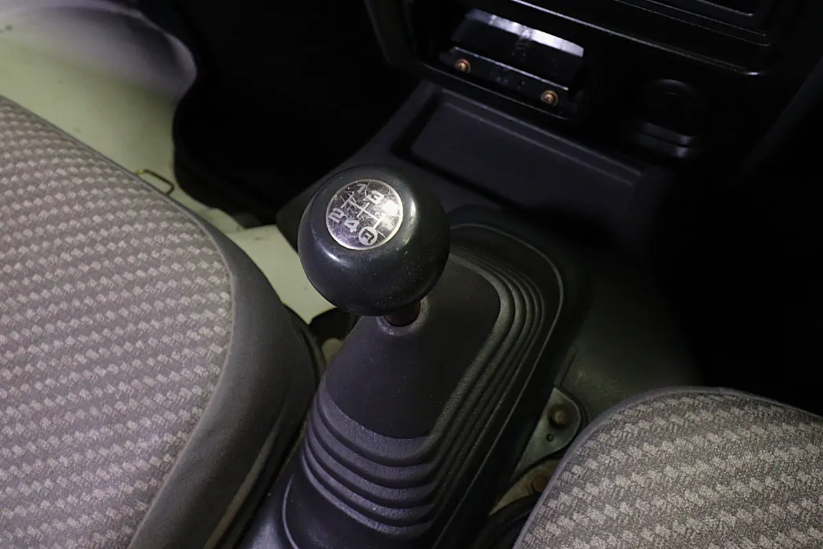 White 1999 Daihatsu Hijet 4x4 Kei Truck, gear shifter, for sale at Duncan Imports in Christiansburg, VA