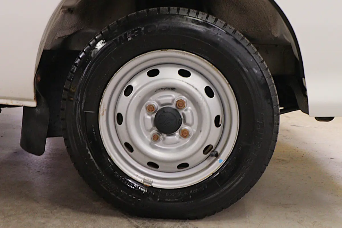 White 1999 Daihatsu Hijet 4x4 Kei Truck, wheel and tire, for sale at Duncan Imports in Christiansburg, VA