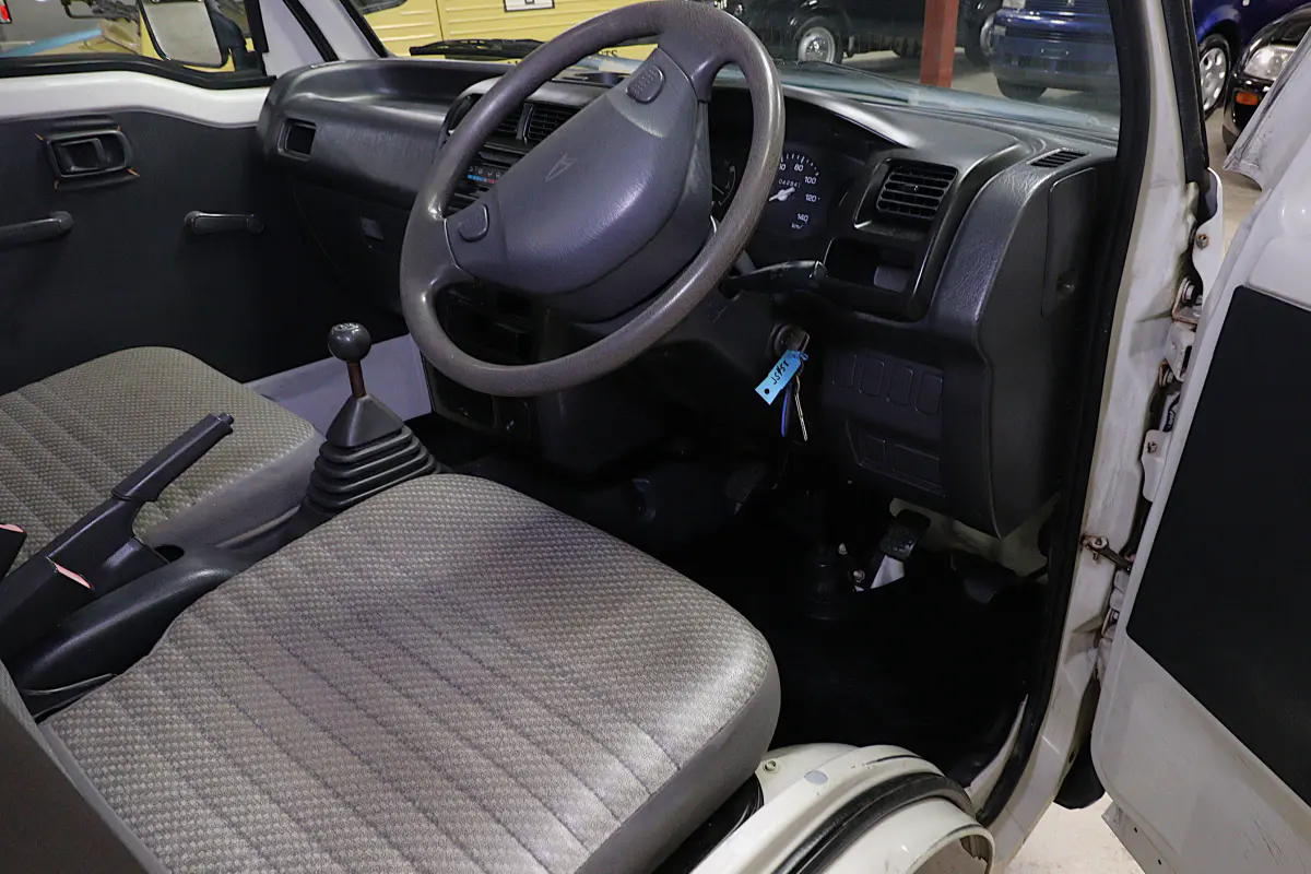 White 1999 Daihatsu Hijet 4x4 Kei Truck, cab interior, for sale at Duncan Imports in Christiansburg, VA