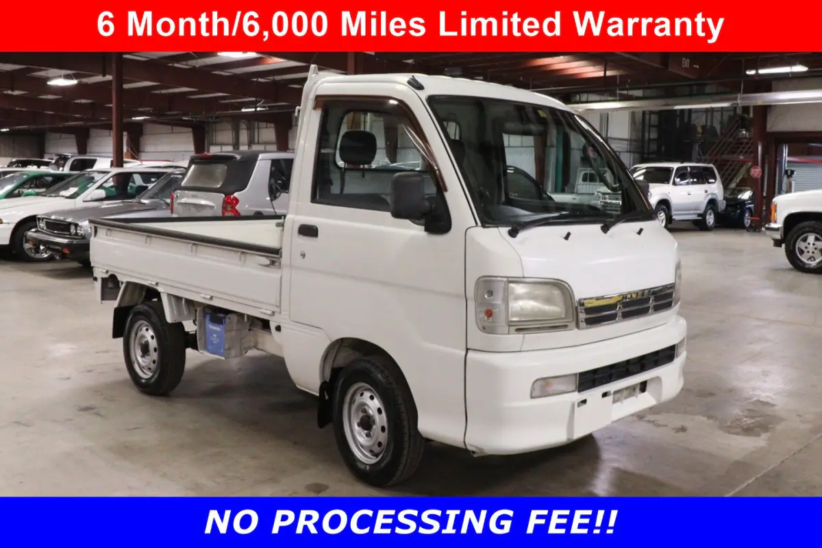 White 1999 Daihatsu Hijet 4x4 Kei Truck, front three-quarter view, for sale at Duncan Imports in Christiansburg, VA