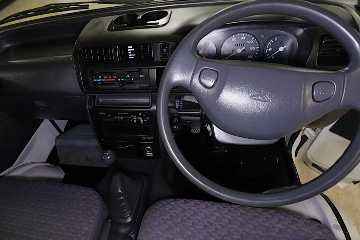 White 1999 Daihatsu Hijet 4x4 Kei Truck, dashboard and steering wheel, for sale at Duncan Imports in Christiansburg, VA