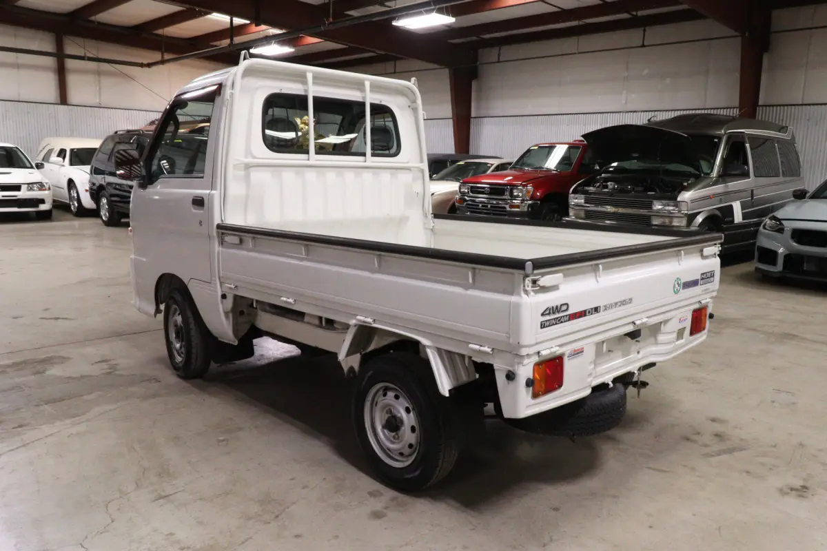 White 1999 Daihatsu Hijet 4x4 Kei Truck, rear three-quarter view, for sale at Duncan Imports in Christiansburg, VA