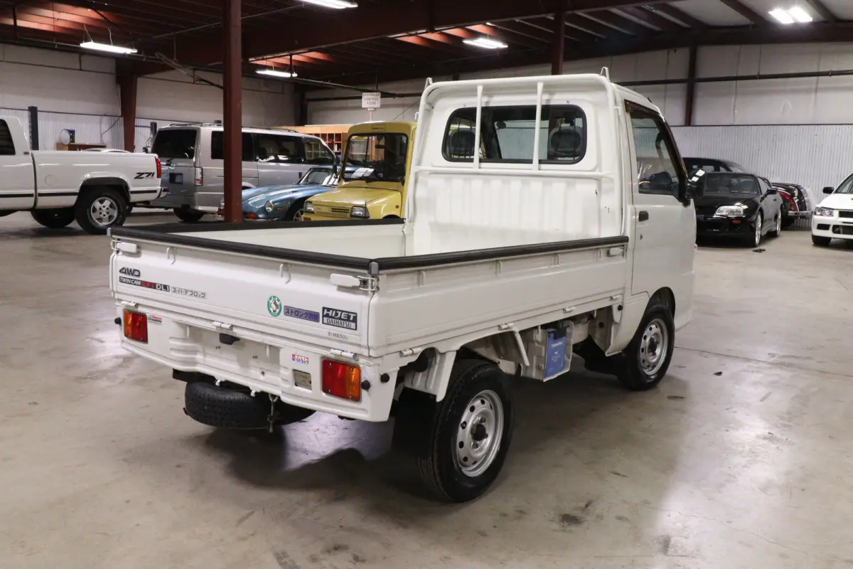 White 1999 Daihatsu Hijet 4x4 Kei Truck, rear three-quarter view, for sale at Duncan Imports in Christiansburg, VA