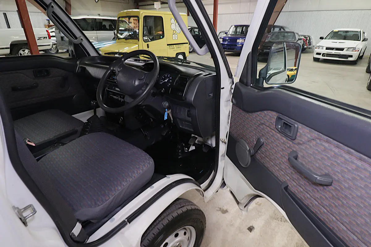 White 1999 Daihatsu Hijet 4x4 Kei Truck, cab interior, for sale at Duncan Imports in Christiansburg, VA