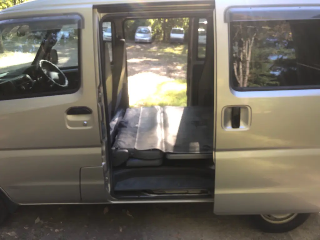 1999 Mitsubishi Minicab 4x4 Kei Van, side interior with folded rear seat, for sale at Fun Karz in North Little Rock, AR