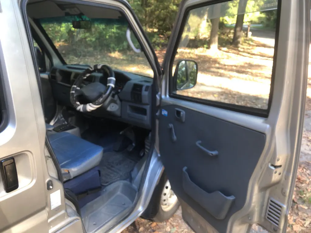 1999 Mitsubishi Minicab 4x4 Kei Van, open door and cab interior, for sale at Fun Karz in North Little Rock, AR