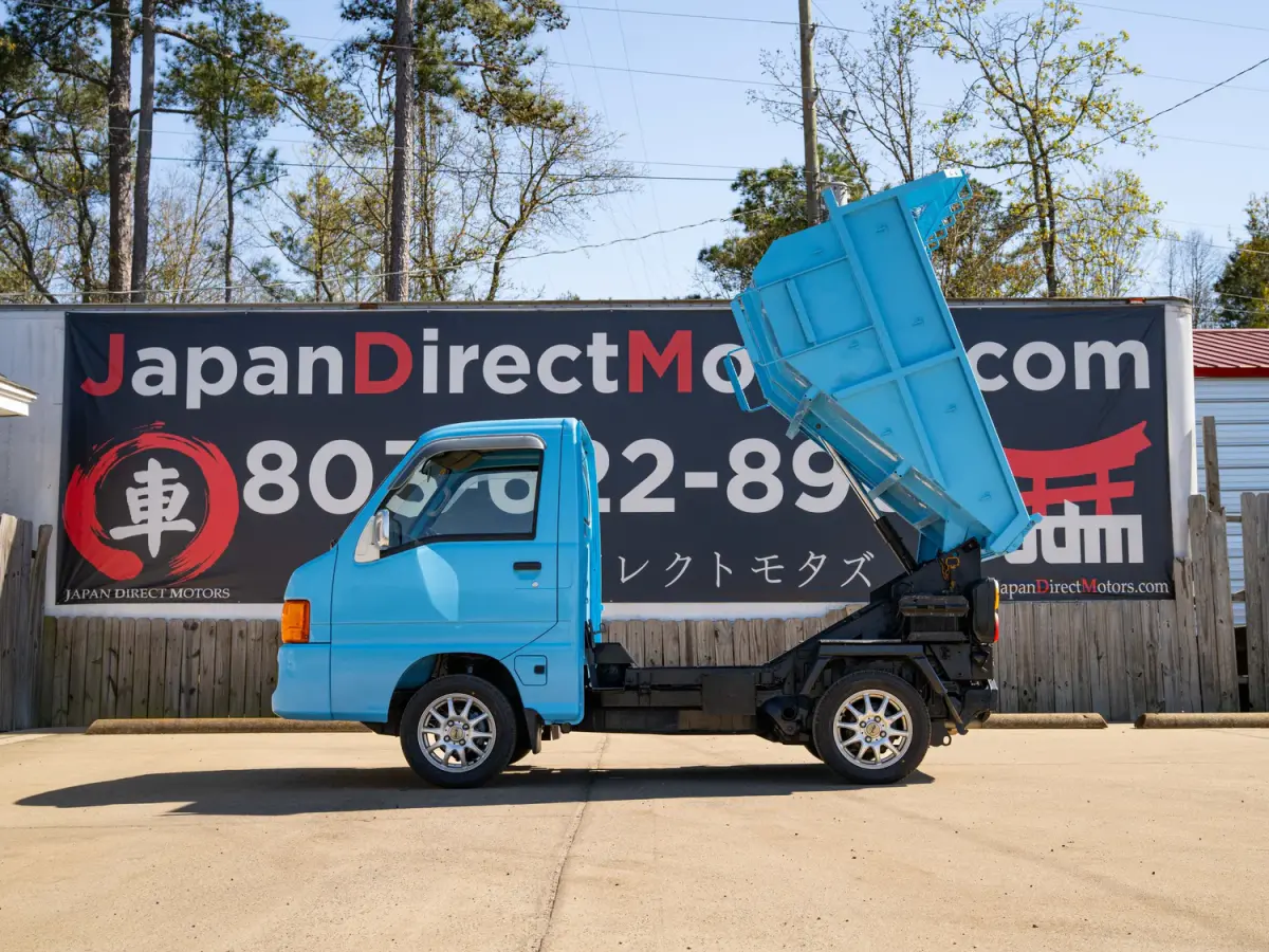 1999 Subaru Sambar Dump Bed, a blue Kei Truck, for sale at Japan Direct Motors in Irmo, SC (photo 11 of 12)