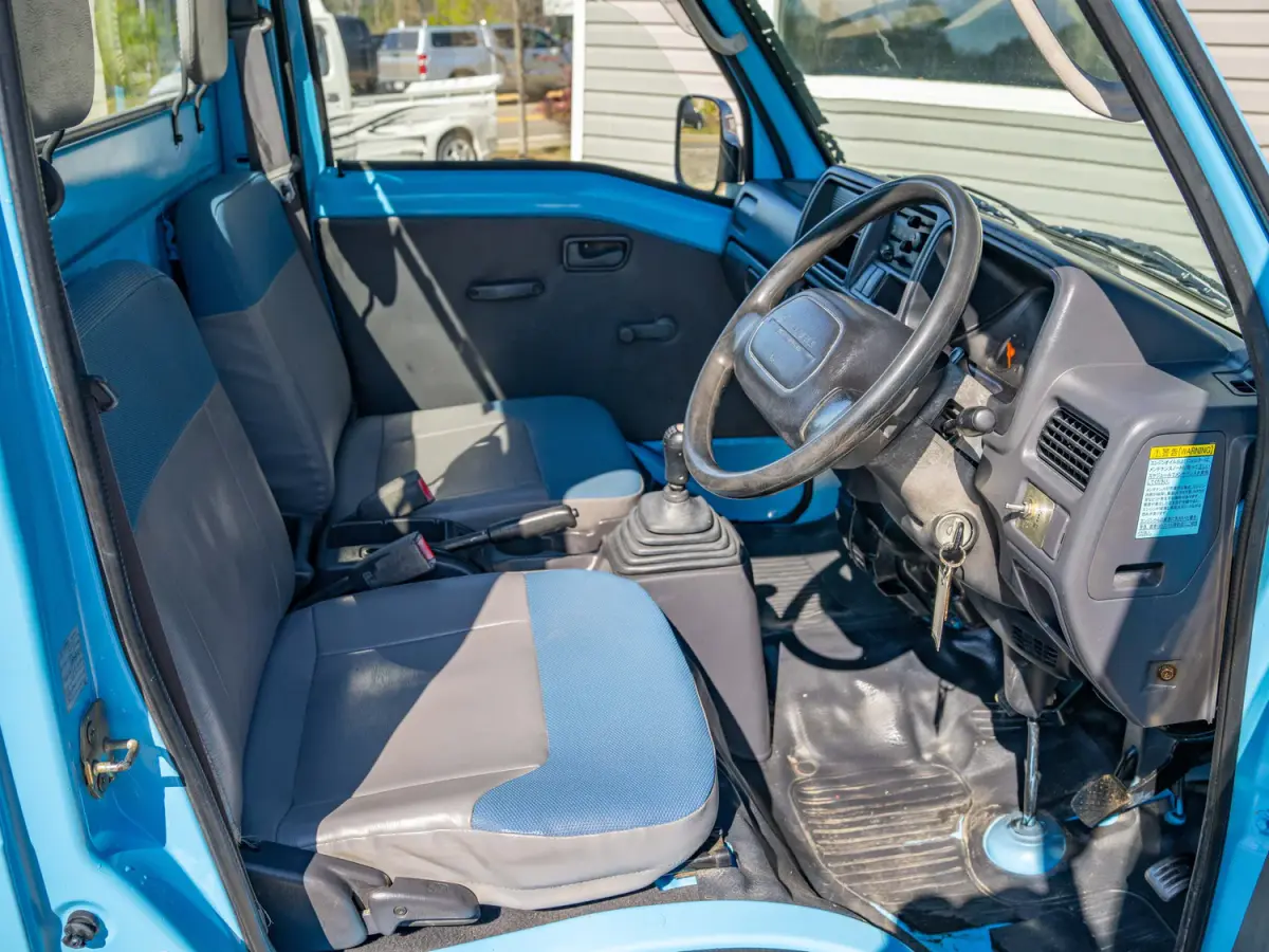 1999 Subaru Sambar Dump Bed, a blue Kei Truck, for sale at Japan Direct Motors in Irmo, SC (photo 12 of 12)