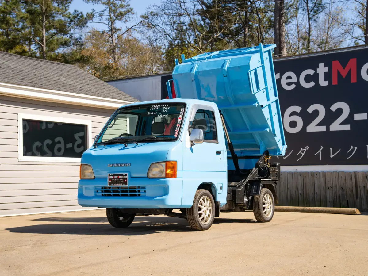 1999 Subaru Sambar Dump Bed, a blue Kei Truck, for sale at Japan Direct Motors in Irmo, SC (photo 3 of 12)
