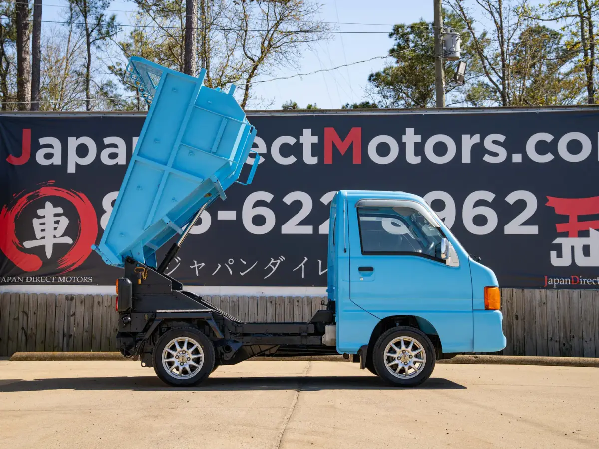 1999 Subaru Sambar Dump Bed, a blue Kei Truck, for sale at Japan Direct Motors in Irmo, SC (photo 6 of 12)