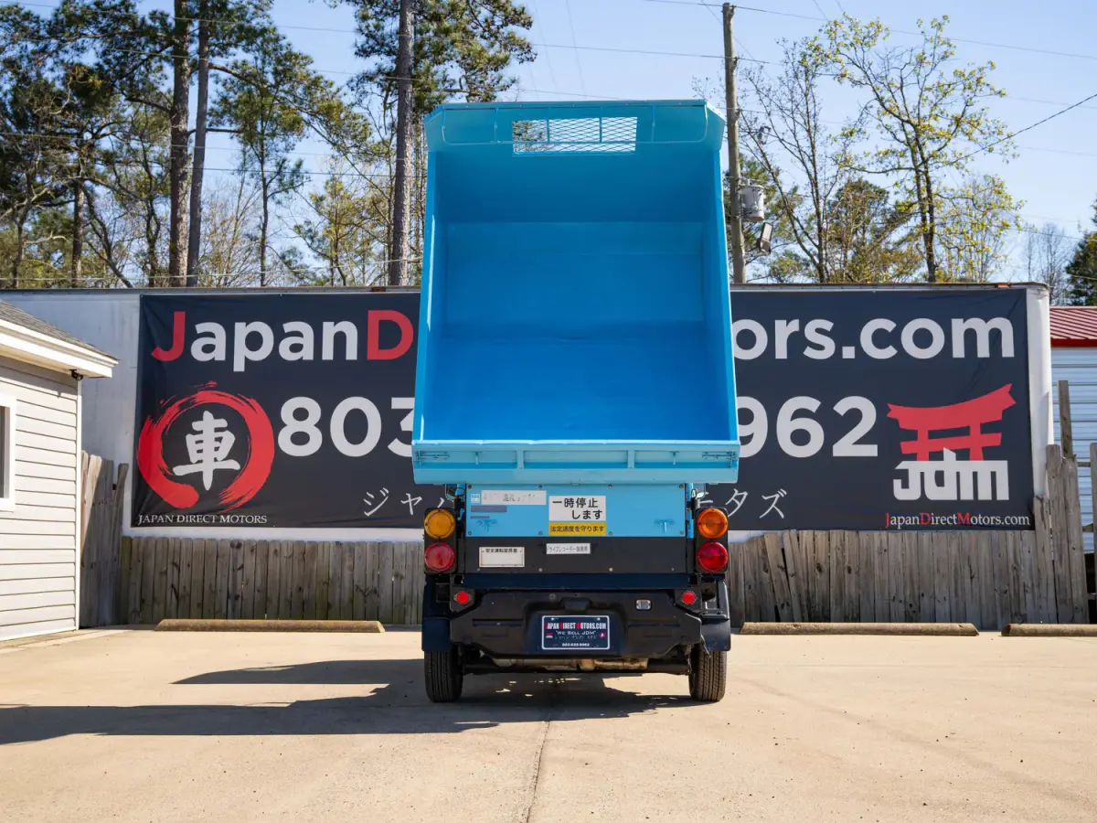 1999 Subaru Sambar Dump Bed, a blue Kei Truck, for sale at Japan Direct Motors in Irmo, SC (photo 9 of 12)