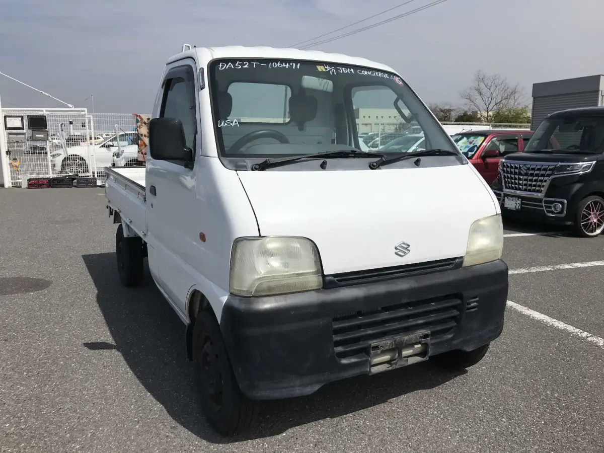 1999 Suzuki Carry, 2WD and AC, a Kei Truck, for sale at Sunshine Imports in Austin, TX (photo 1 of 9)